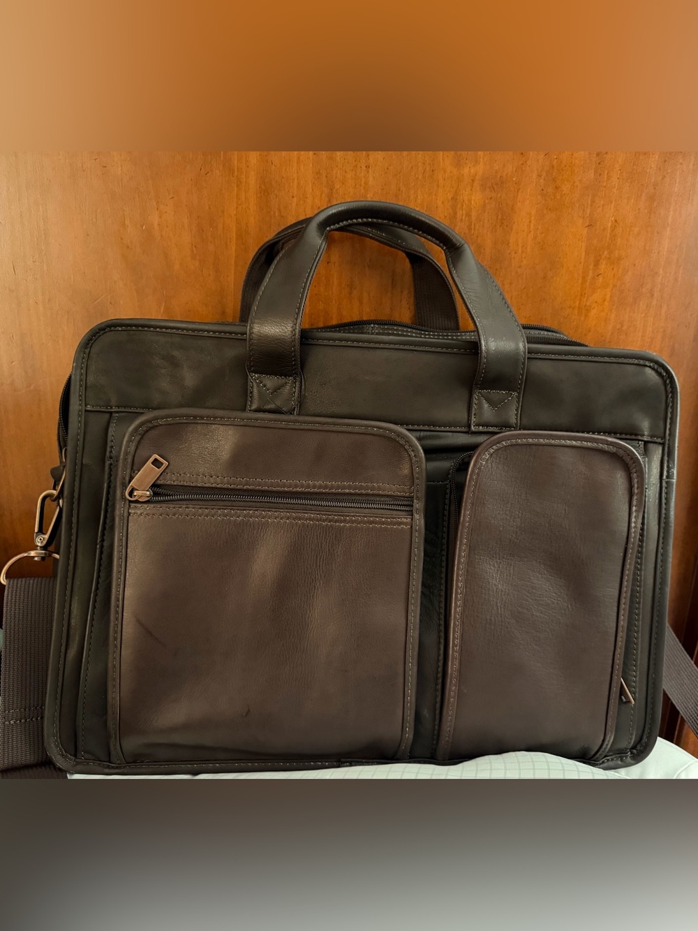 Wilson Leather dark brown leather expandable multi pocket laptop travel bag.